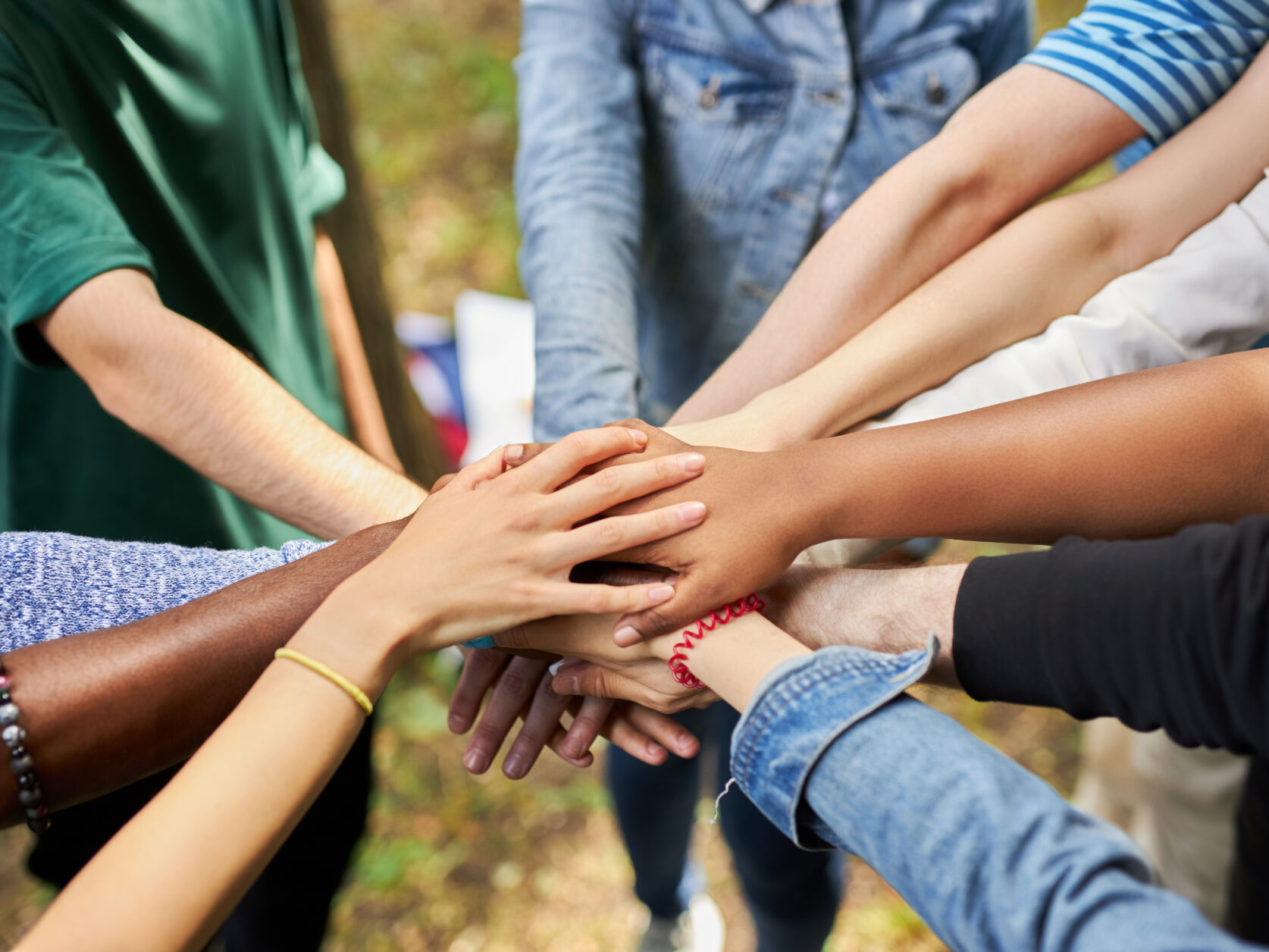 mixed race international group of people gathered together